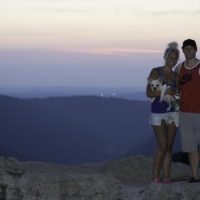 man and women holding French Bulldog puppy